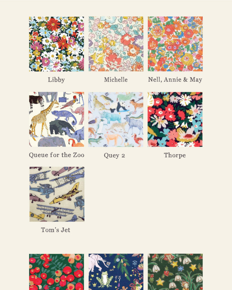 A grid of 24 liberty print fabric swatches with colourful patterns and names underneath, including Adelajda Brown, Besty Ann, Capel Mustard, and others, on a light beige background. The brand name 'Magnificent Stanley' appears at the bottom. Patterns feature cars, planes, flowers, balloons, dinosaurs, stars and cats.