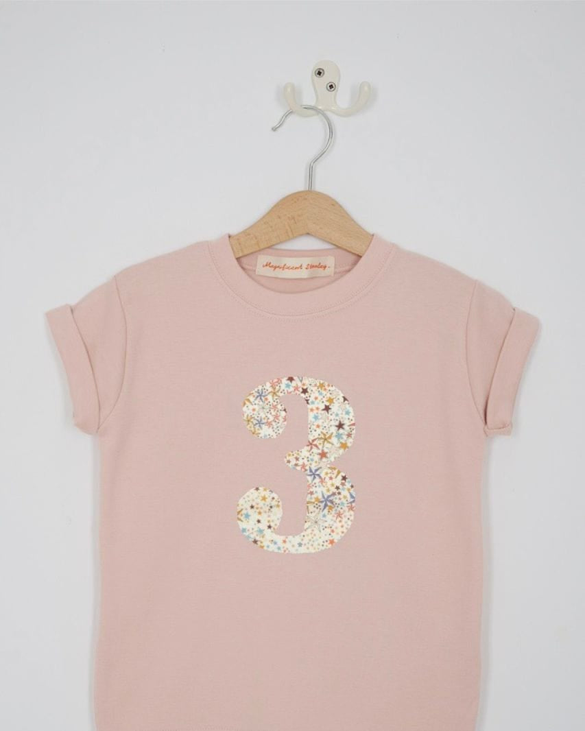 a pink birthday t-shirt with a number 3 cut from adelajda brown liberty floral print on the front