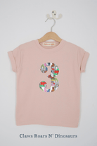 a pink birthday t-shirt with a number 3 cut from dinosaur liberty floral print on the front