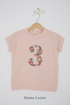 a pink 3rd birthday t-shirt with a number 3 cut from emma louise liberty floral print on the front