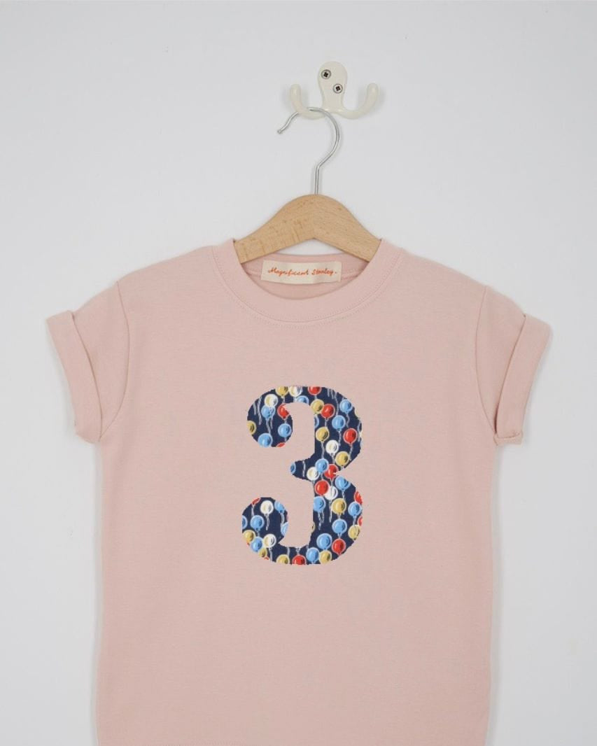 a pink 3rd birthday t-shirt with a number 3 cut from ethan's party balloon liberty floral print on the front