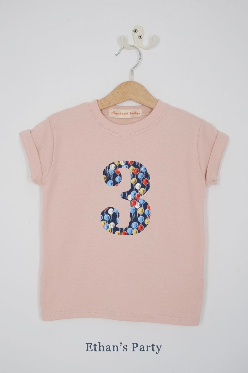 a pink 3rd birthday t-shirt with a number 3 cut from ethan's party balloon liberty floral print on the front