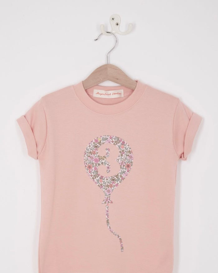 a pink birthday t-shirt with a balloon with the number 3 on it cut from floral Liberty print.