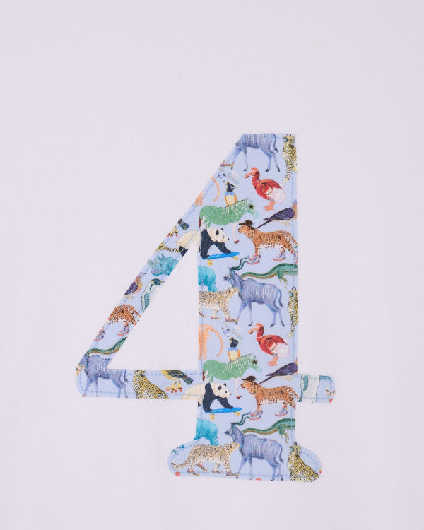 A white cotton t-shirt with the number 4 sewn on the front cut from liberty Quey 2 zoo animal print.