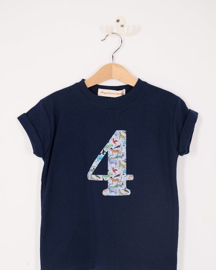 A navy cotton t-shirt with the number 4 sewn on the front cut from liberty Quey 2 zoo animal print.