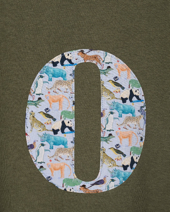 a personalised khaki sweater with a large letter 'O' in Quey 2 liberty animal print.