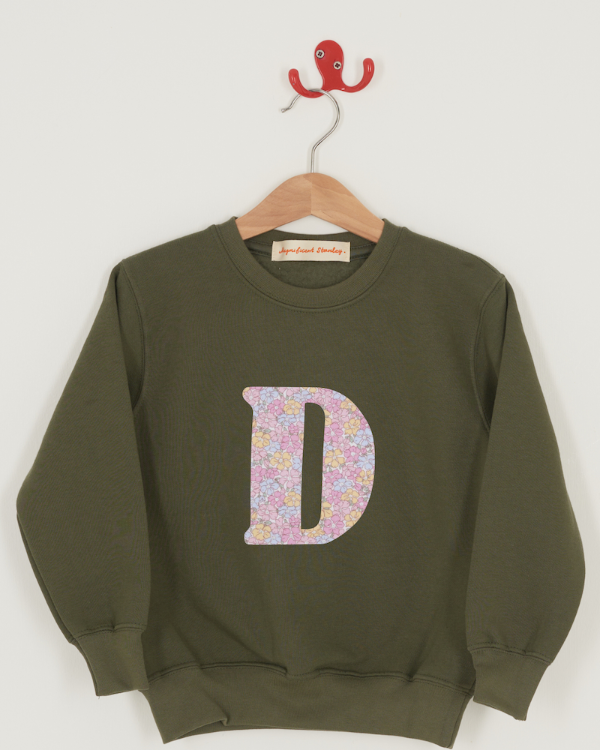 a personalised khaki sweater with a large letter 'D' in sadie rose liberty floral print.