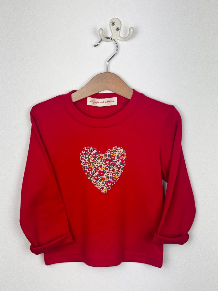 Red t-shirt with a colourful Liberty Betsy Ann print heart design on a white background