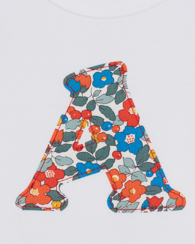 Floral-patterned letter 'A' on a white background