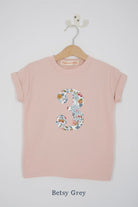 a pink 3rd birthday t-shirt with a number 3 cut from betsy grey liberty floral print on the front