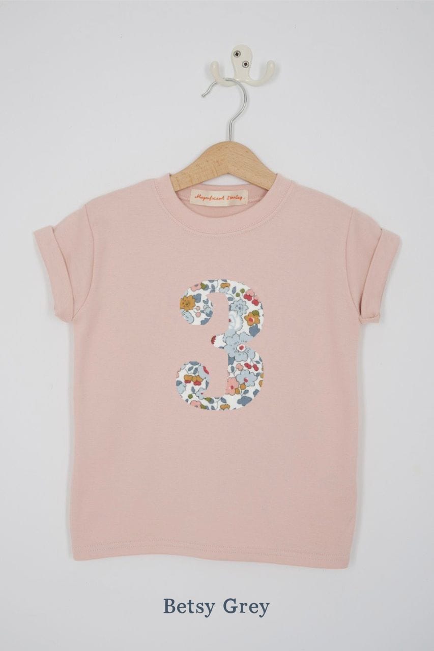 a pink 3rd birthday t-shirt with a number 3 cut from betsy grey liberty floral print on the front