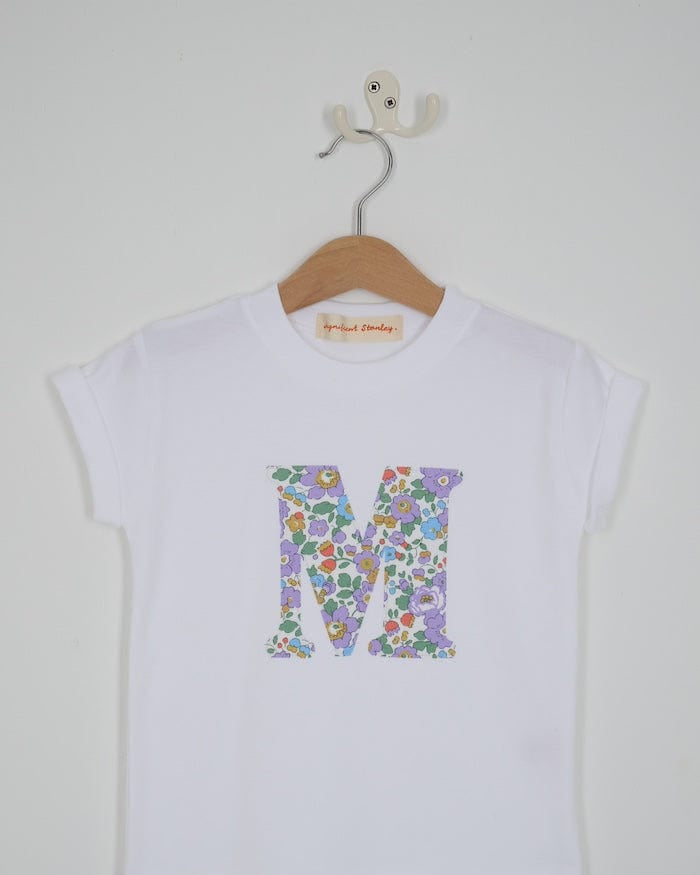 a white cotton short sleeve t-shirt with the number 3 hand-appliqued in a floral Betsy Liberty Print.