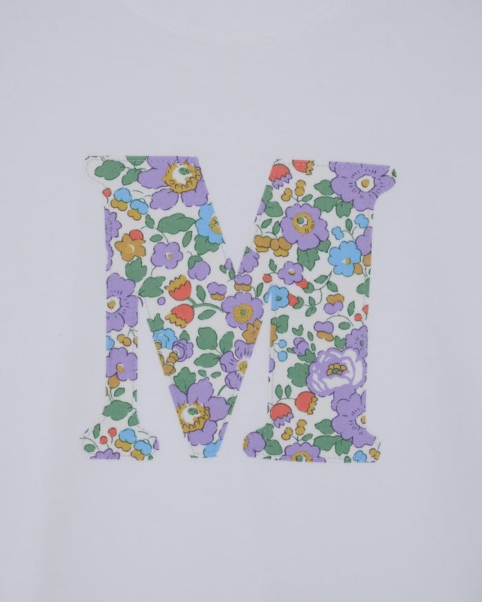 a white cotton short sleeve t-shirt with the number 3 hand-appliqued in a floral Betsy Liberty Print.