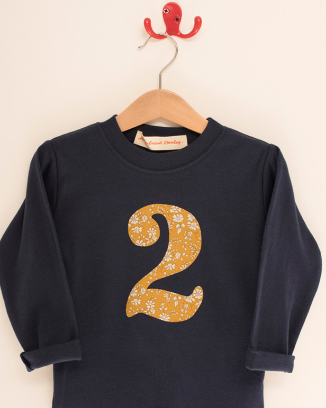 a navy cotton t-shirt with the number 2 on the front cut from capel liberty print