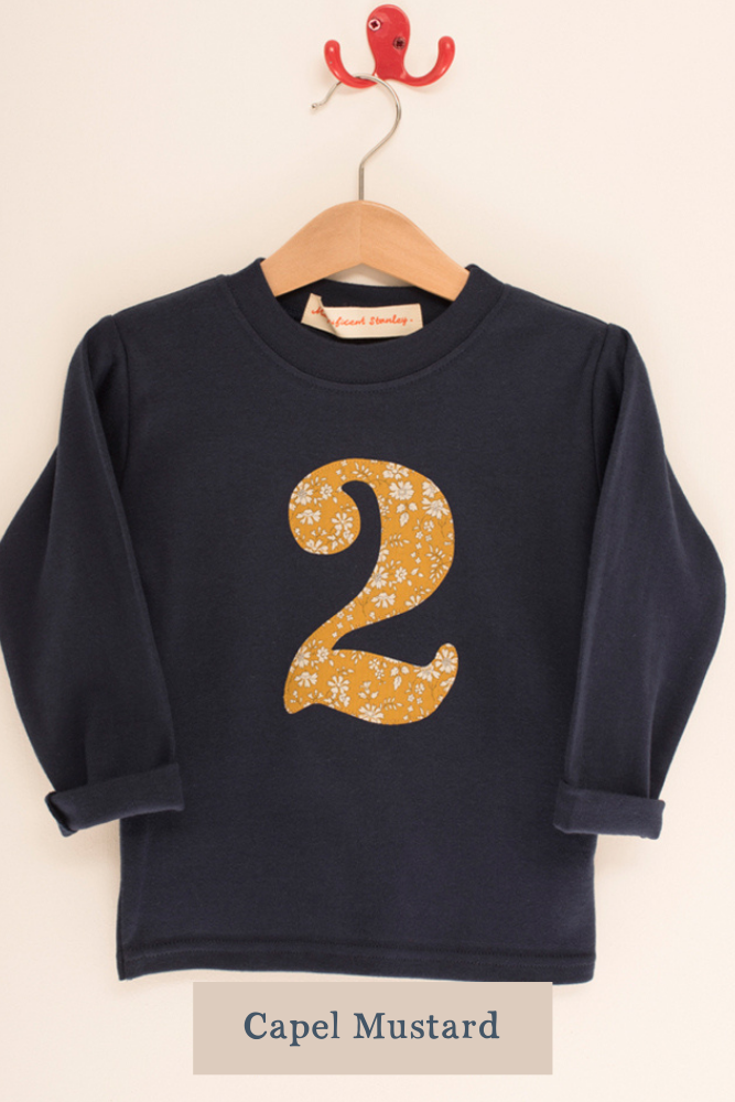 a navy cotton t-shirt with the number 2 on the front cut from capel liberty print