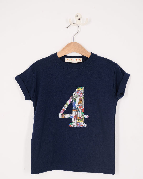 a navy kids birthday t-shirt with a colourful number 4 design in Liberty dinosaur print on the front