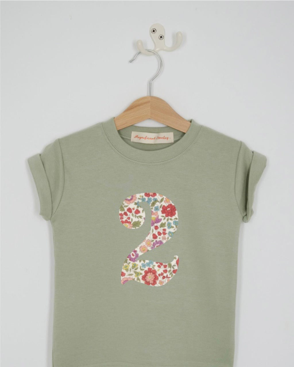 a number 2nd birthday kids sage green t-shirt with a number cut from d'anjo floral liberty print on the front.