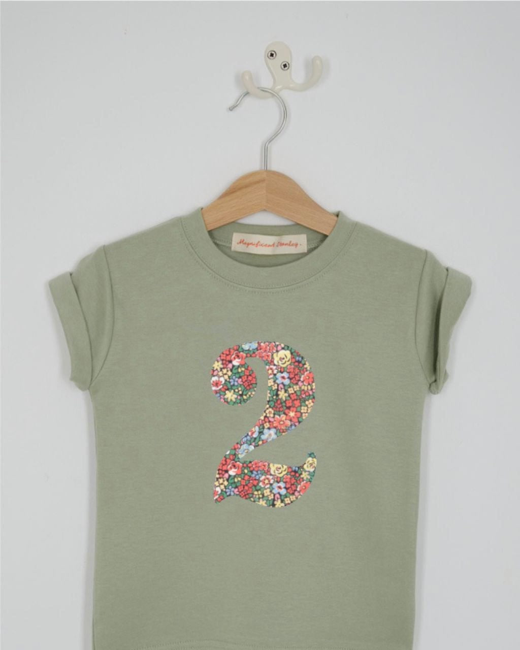 a number 2nd birthday kids sage green t-shirt with a number cut from emma louise liberty print on the front.