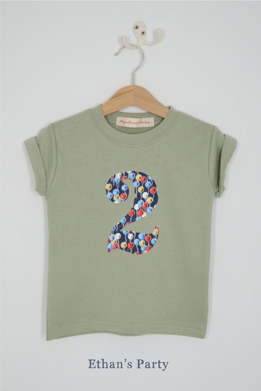 a number 2nd birthday kids sage green t-shirt with a number cut from ethan's party balloon liberty print on the front.