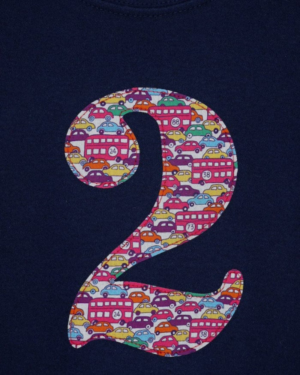 a navy cotton kids birthday t-shirt with the number 2 in a red Hop on hop off Liberty print.