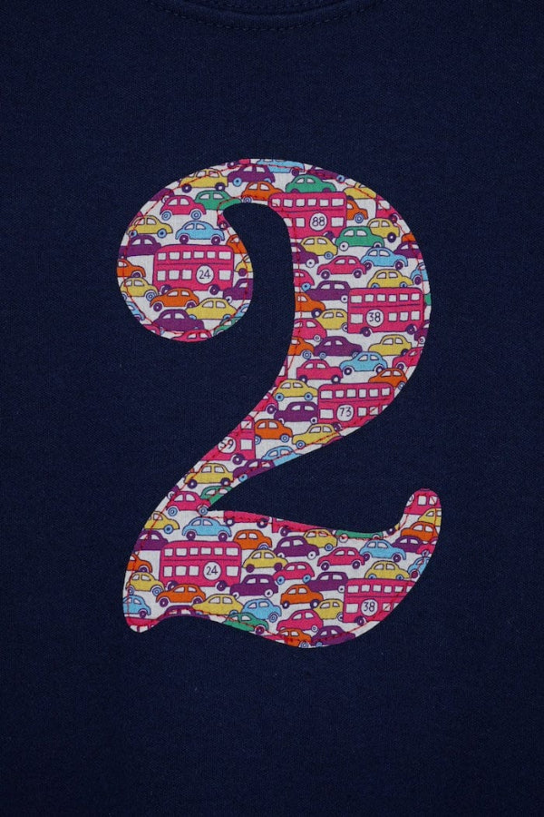 a navy cotton kids birthday t-shirt with the number 2 in a red Hop on hop off Liberty print.