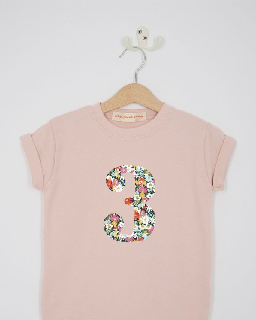 a pink 3rd birthday t-shirt with a number 3 cut from libby liberty floral print on the front