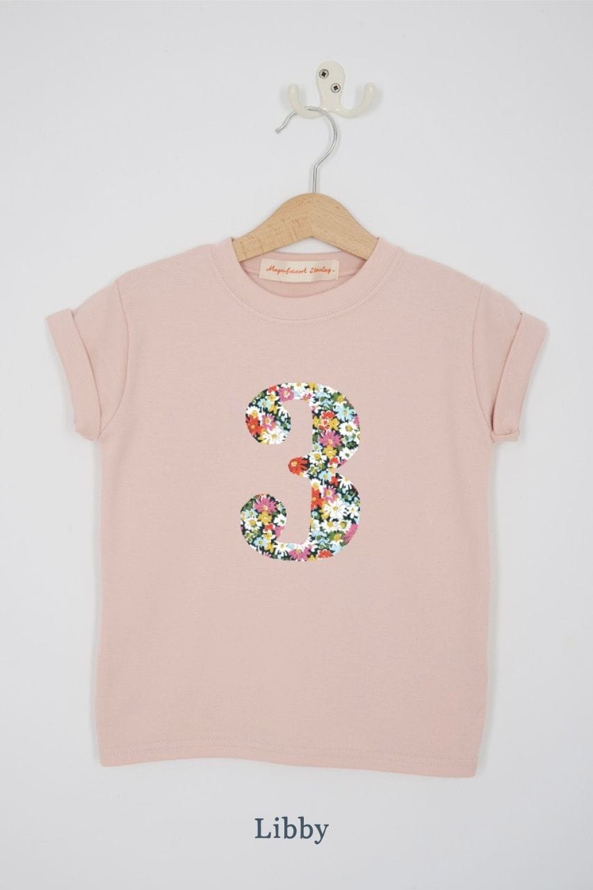 a pink 3rd birthday t-shirt with a number 3 cut from libby liberty floral print on the front