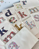 Personalised Liberty print pouches with initials sewn on them. Teacher gifts for make up or stationery.