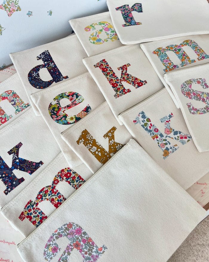 Personalised Liberty print pouches with initials sewn on them. Teacher gifts for make up or stationery.
