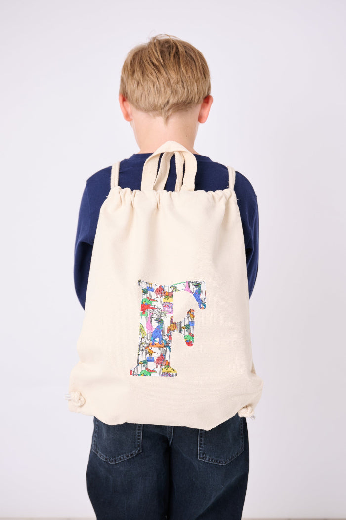 A child wearing a Personalised Liberty Print drawstring backpack rucksack
