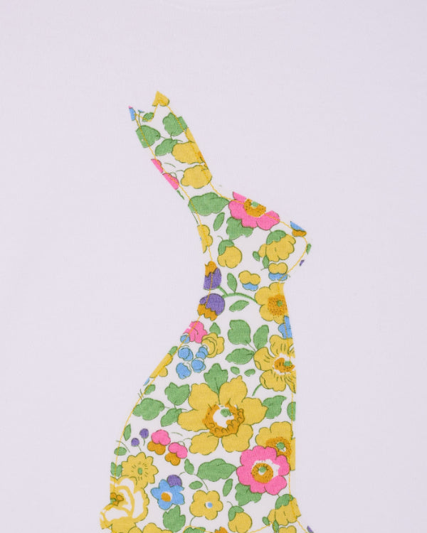 a white cotton baby bodysuit with an easter bunny made from Betsy Liberty Print sewn onto the front.