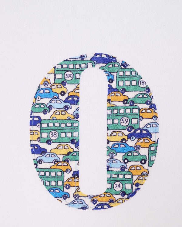 A close up of the stitching of an initial on a Personalised Bodysuit in Hop On Hop Off Liberty Print