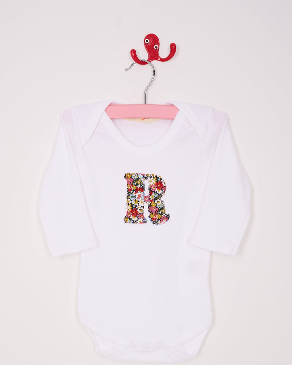 a Personalised initial baby Bodysuit in Libby floral Liberty Print.