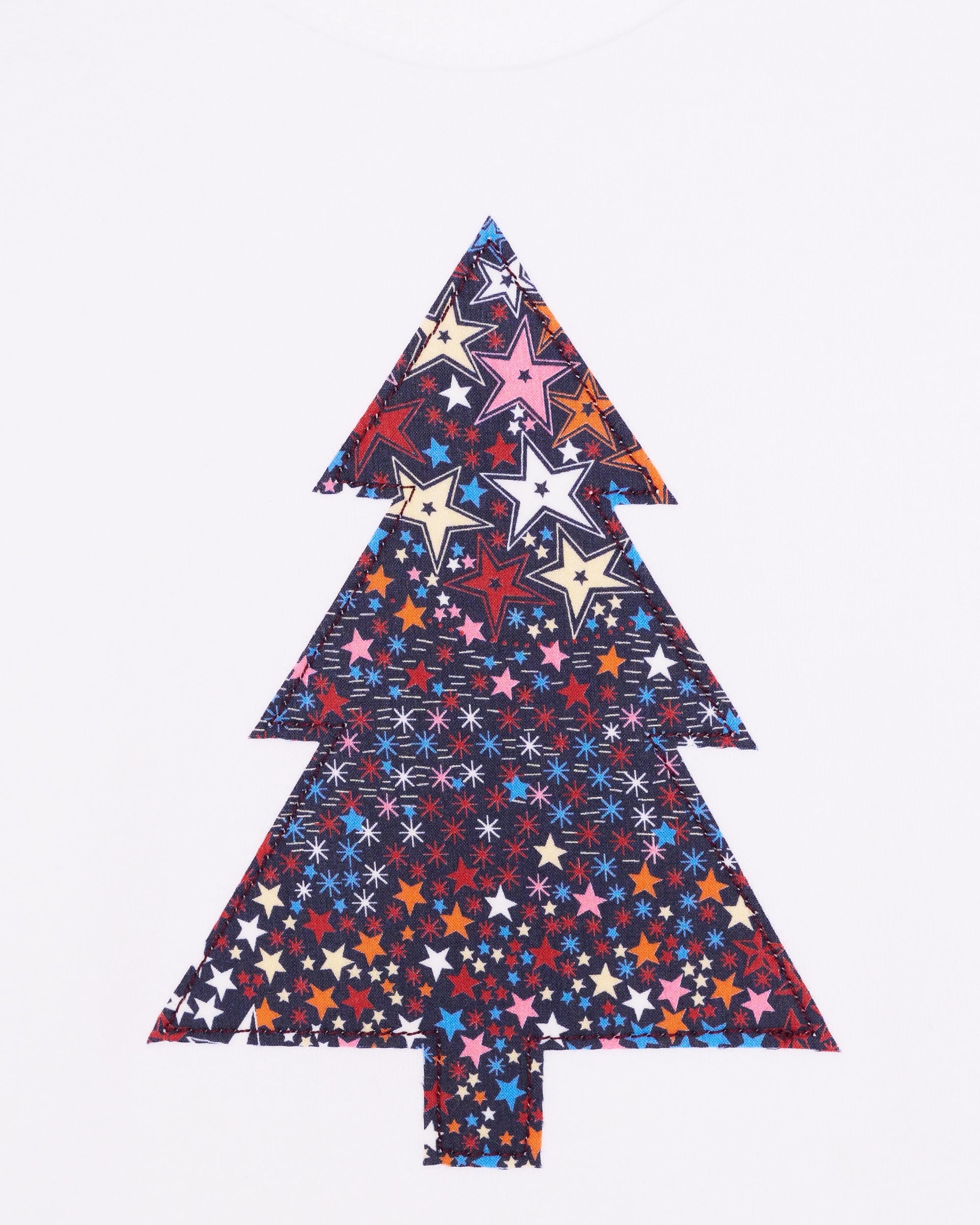 A white bodysuit babygrow with a Liberty Adelajda's Wish print Christmas tree sewn on the front.
