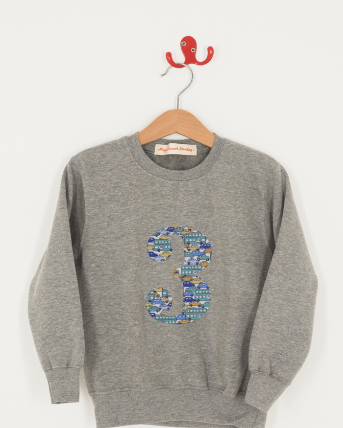 A birthday grey sweatshirt with a number 3 on in cars Liberty fabric.