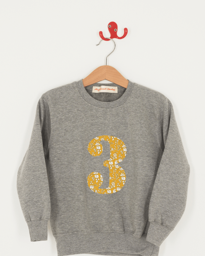 A birthday grey sweatshirt with a number 3 on in Capel floral Liberty fabric.