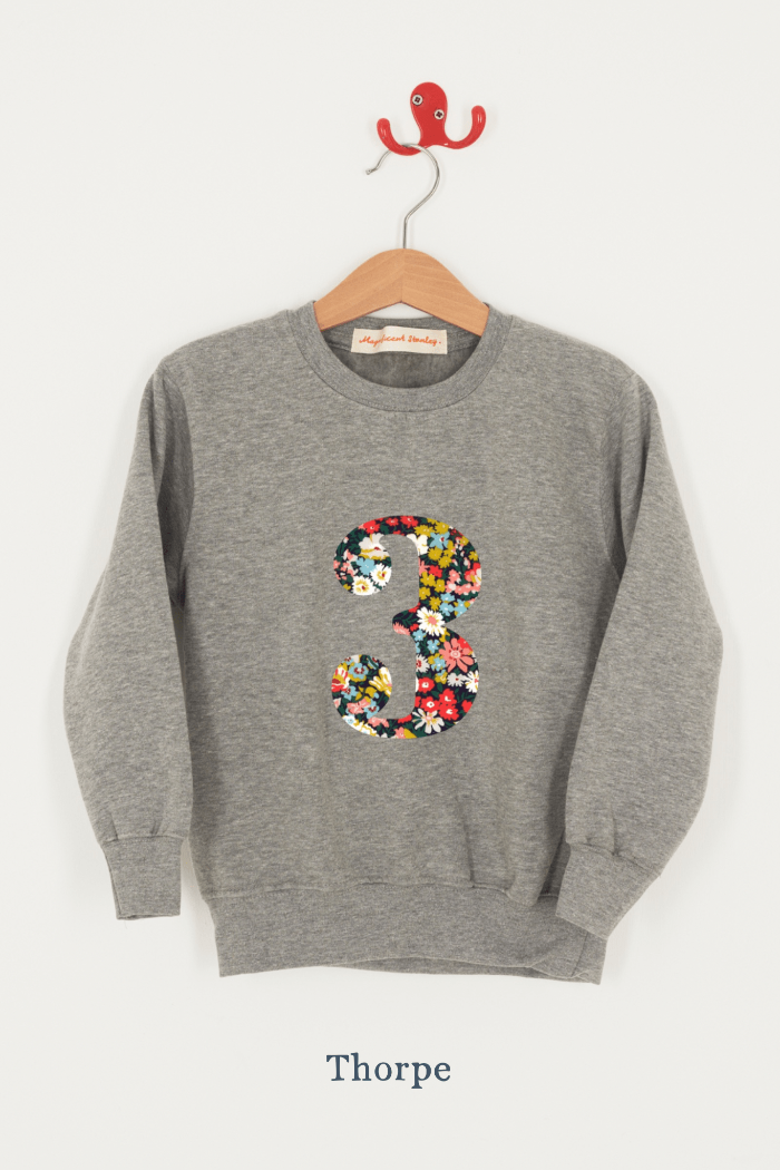 A birthday grey sweatshirt with a number 3 on in Thorpe floral Liberty fabric.