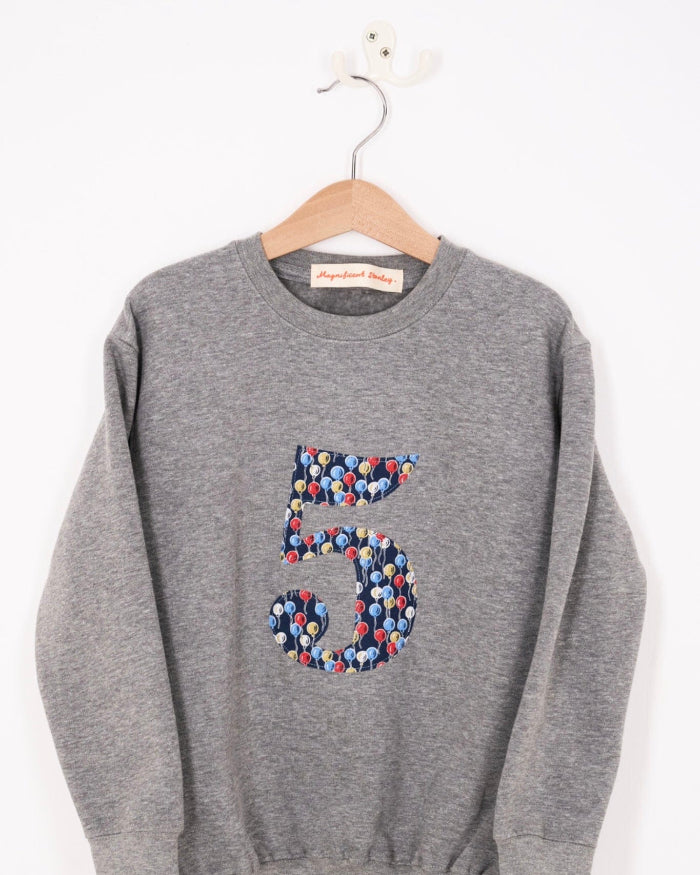 A birthday grey sweatshirt with a number 5 on in Balloon floral Liberty fabric.