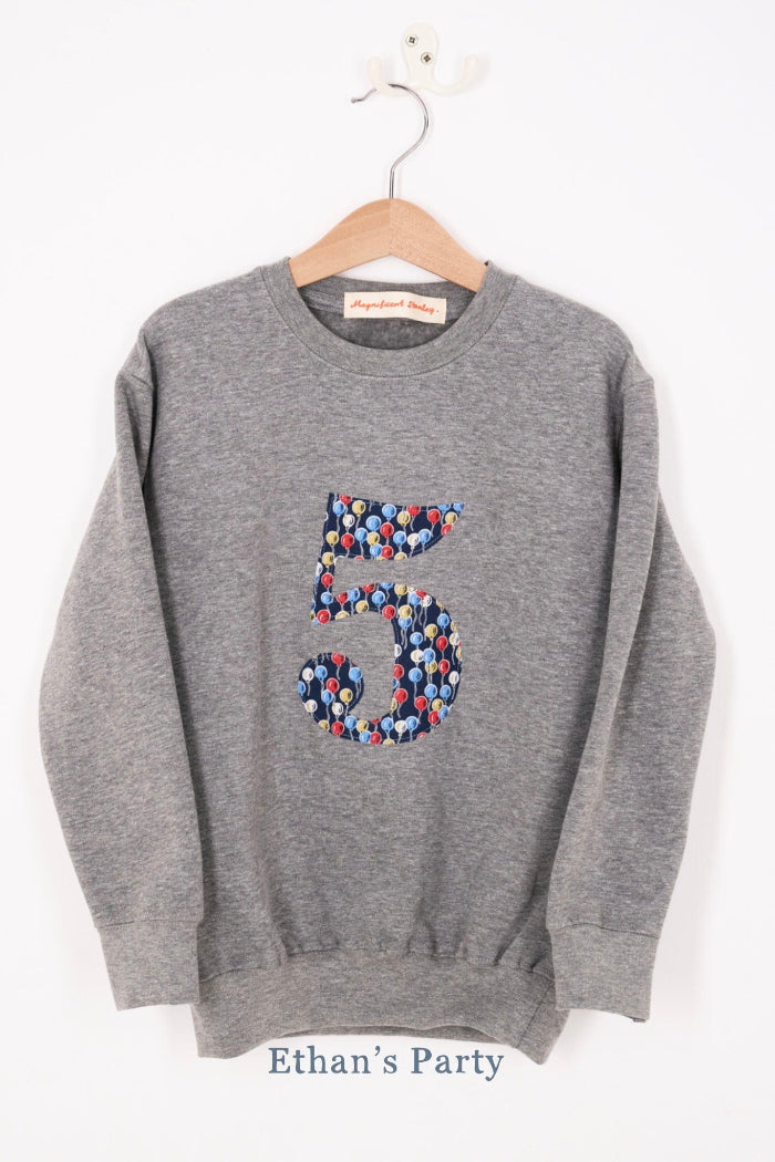 A birthday grey sweatshirt with a number 5 on in Balloon floral Liberty fabric.