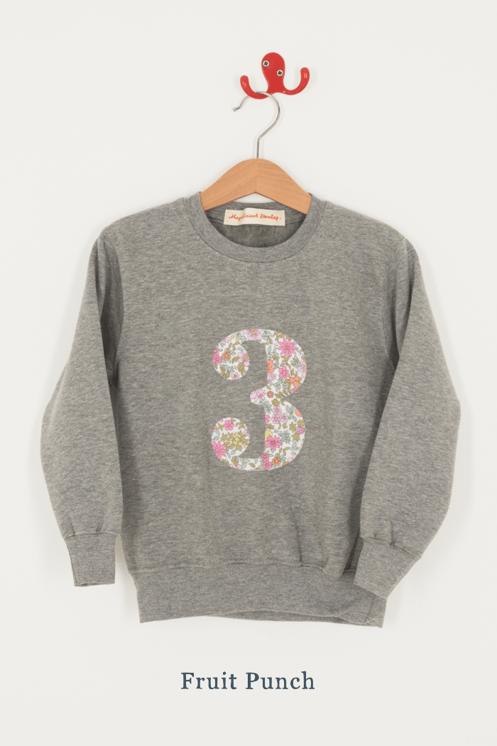 A birthday grey sweatshirt with a number 3 on in Fruit Punch floral Liberty fabric.