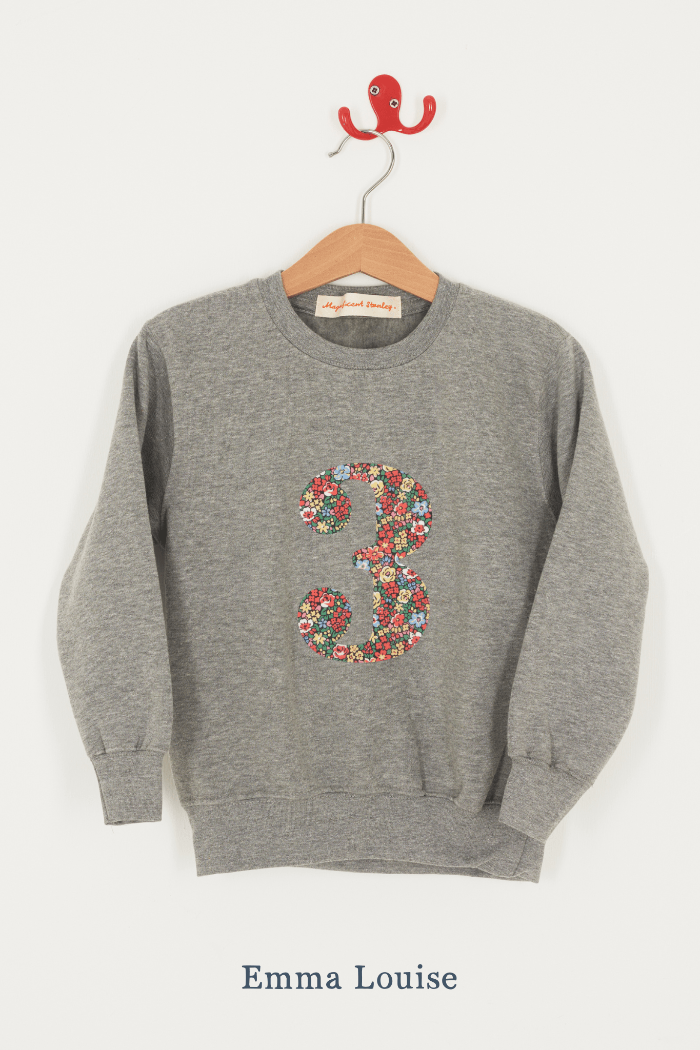 A birthday grey sweatshirt with a number 3 on in Emma Louise Liberty fabric.