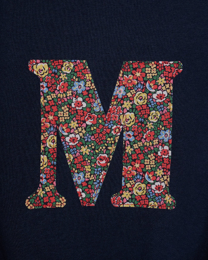 A navy Magnificent Stanley personalised Navy Sweatshirt with her initial on the front in floral emma louise liberty print.