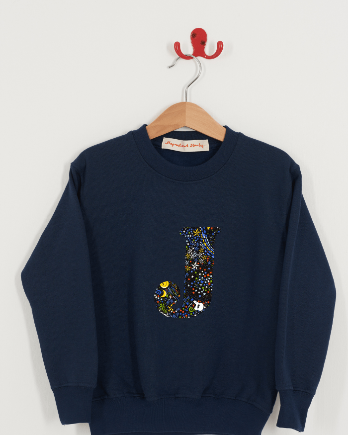 A Magnificent Stanley kids personalised Navy Sweatshirt with an initial on the front in Adelajda in space liberty print.