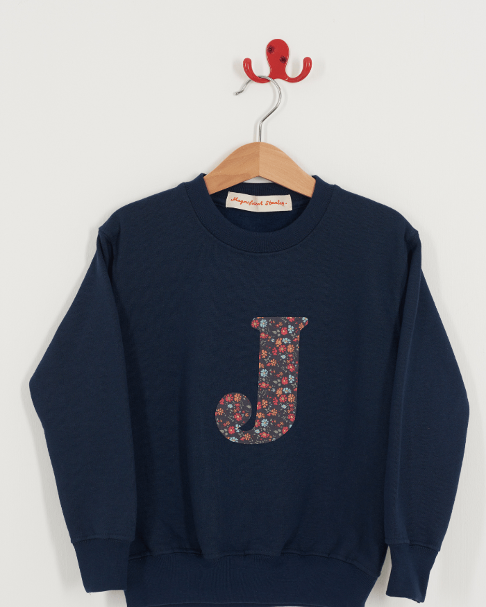 A Magnificent Stanley kids personalised Navy Sweatshirt with an initial on the front in Capel Floret liberty print.
