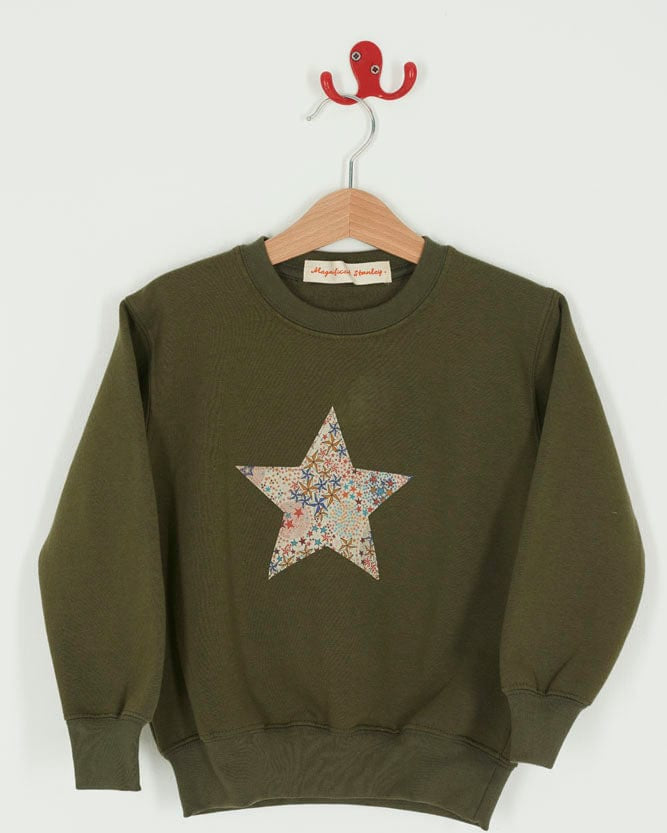 A Magnificent Stanley Khaki Christmas Jumper Sweatshirt with a star on the front made from Liberty Print fabric.
