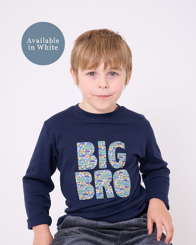 5 year old boy who is a Big Brother wearing a navy t-shirt with BIG BRO sewn onto it in vintage liberty cars print.