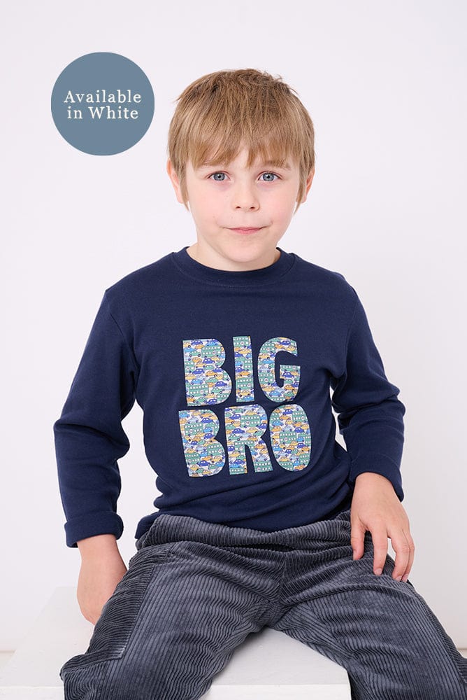 5 year old boy who is a Big Brother wearing a navy t-shirt with BIG BRO sewn onto it in vintage liberty cars print.