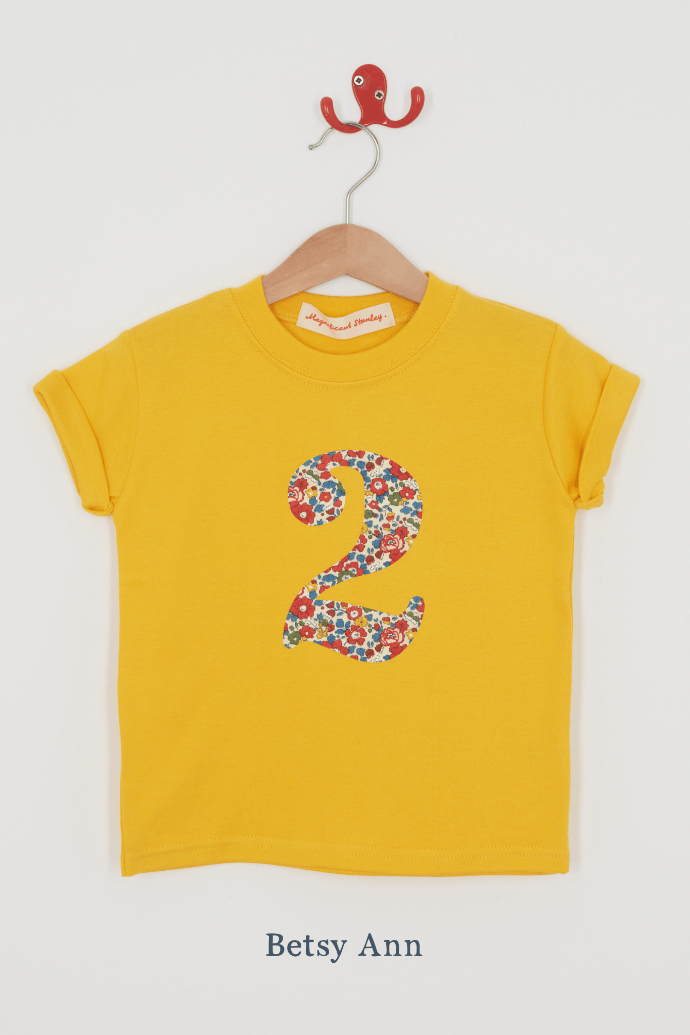 a yellow birthday t-shirt with a number 2 cut from liberty betsy ann floral print on the front