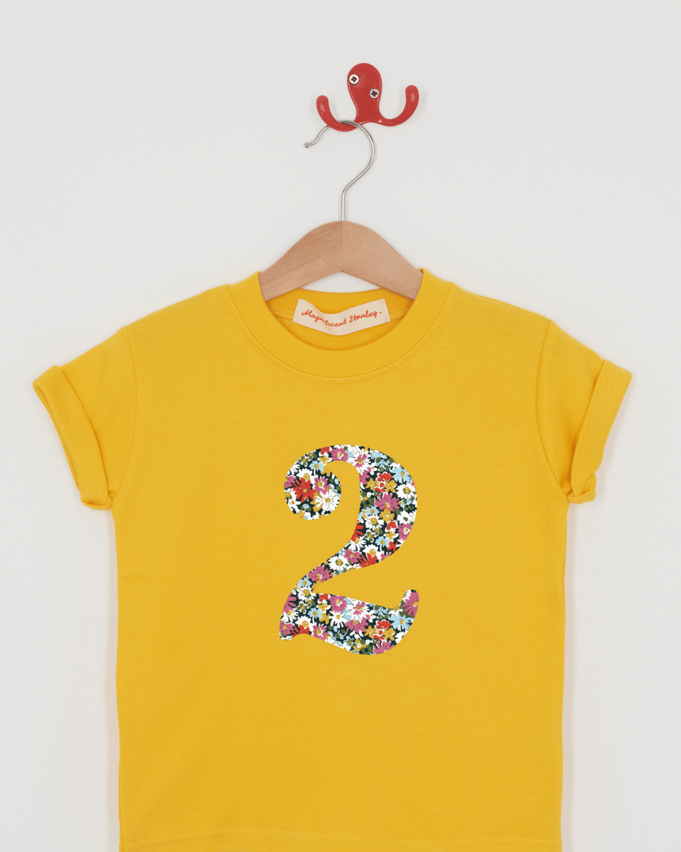 a yellow birthday t-shirt with a number 2 cut from libby liberty floral print on the front.