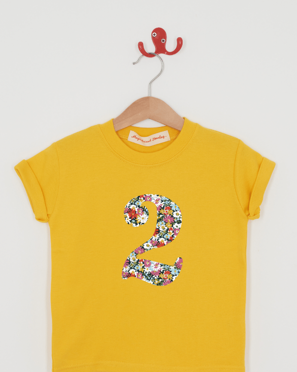 a yellow birthday t-shirt with a number 2 cut from libby liberty floral print on the front.